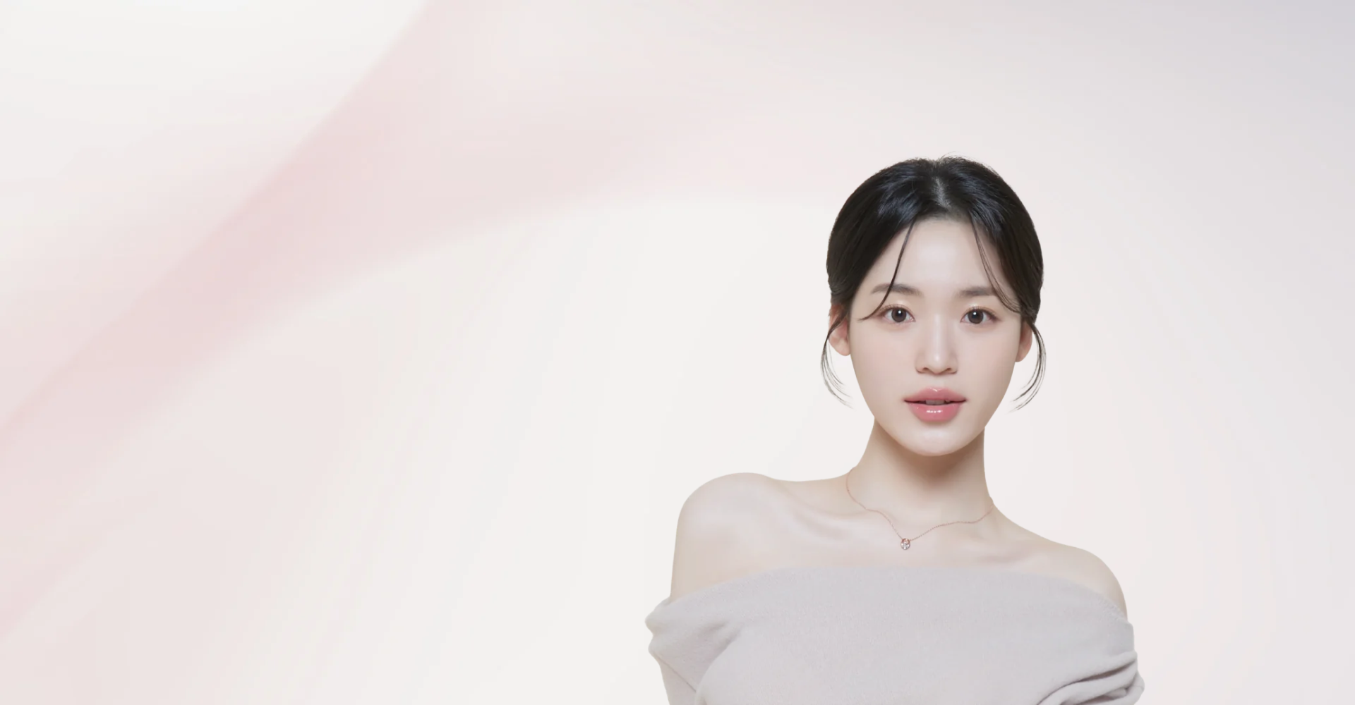 オフショルダーの服を着た、リップが印象的な女性の顔写真